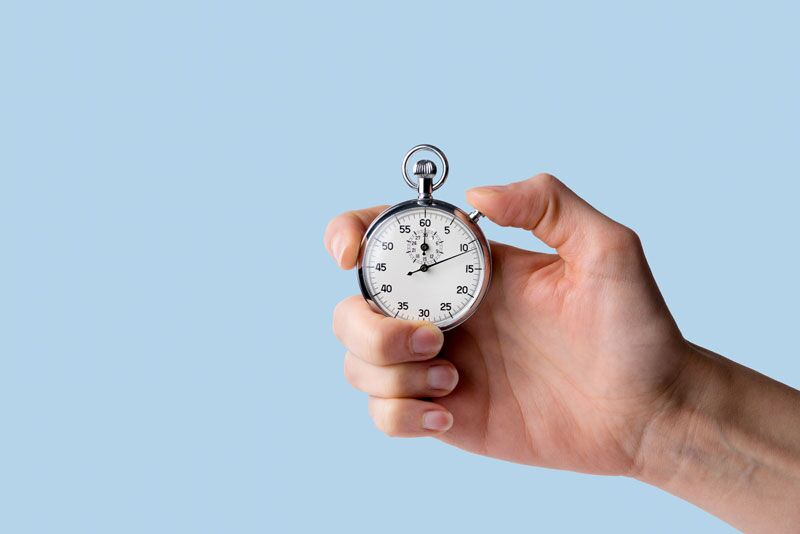 hand holding a stopwatch, final ruling on overtime pay
