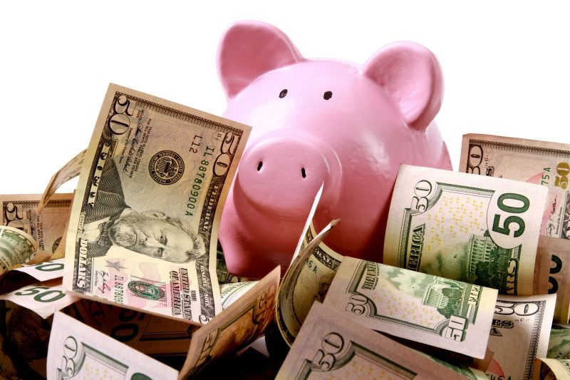piggy bank surrounded by money, nearly all state flagship institutions are unaffordable for low- and middle-income students